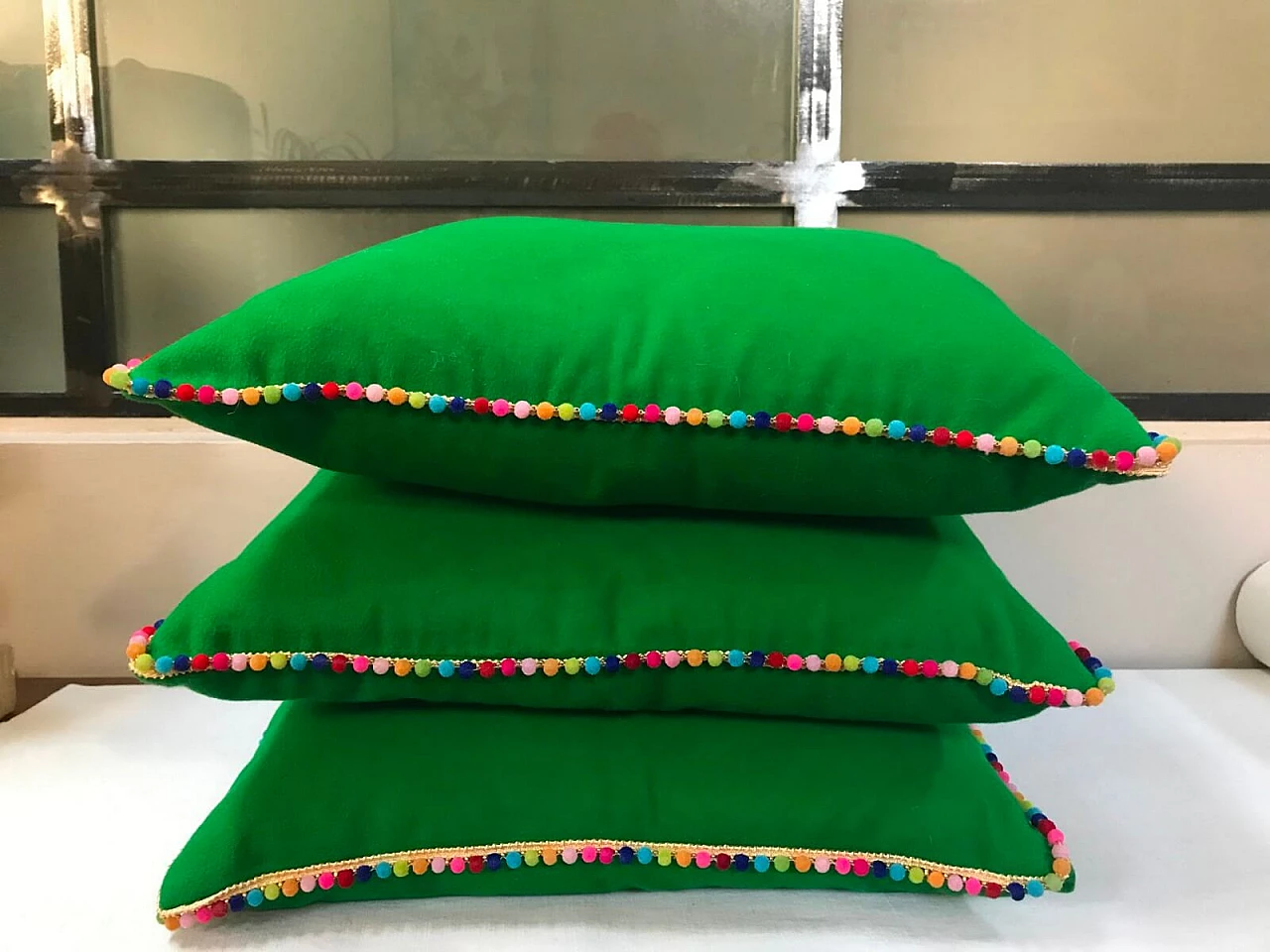 3 cushions in green moleskin with multicoloured dot border 2