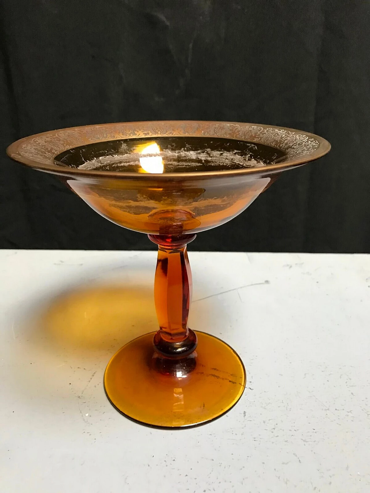 Czechoslovakian cup in amber glass, signed 2