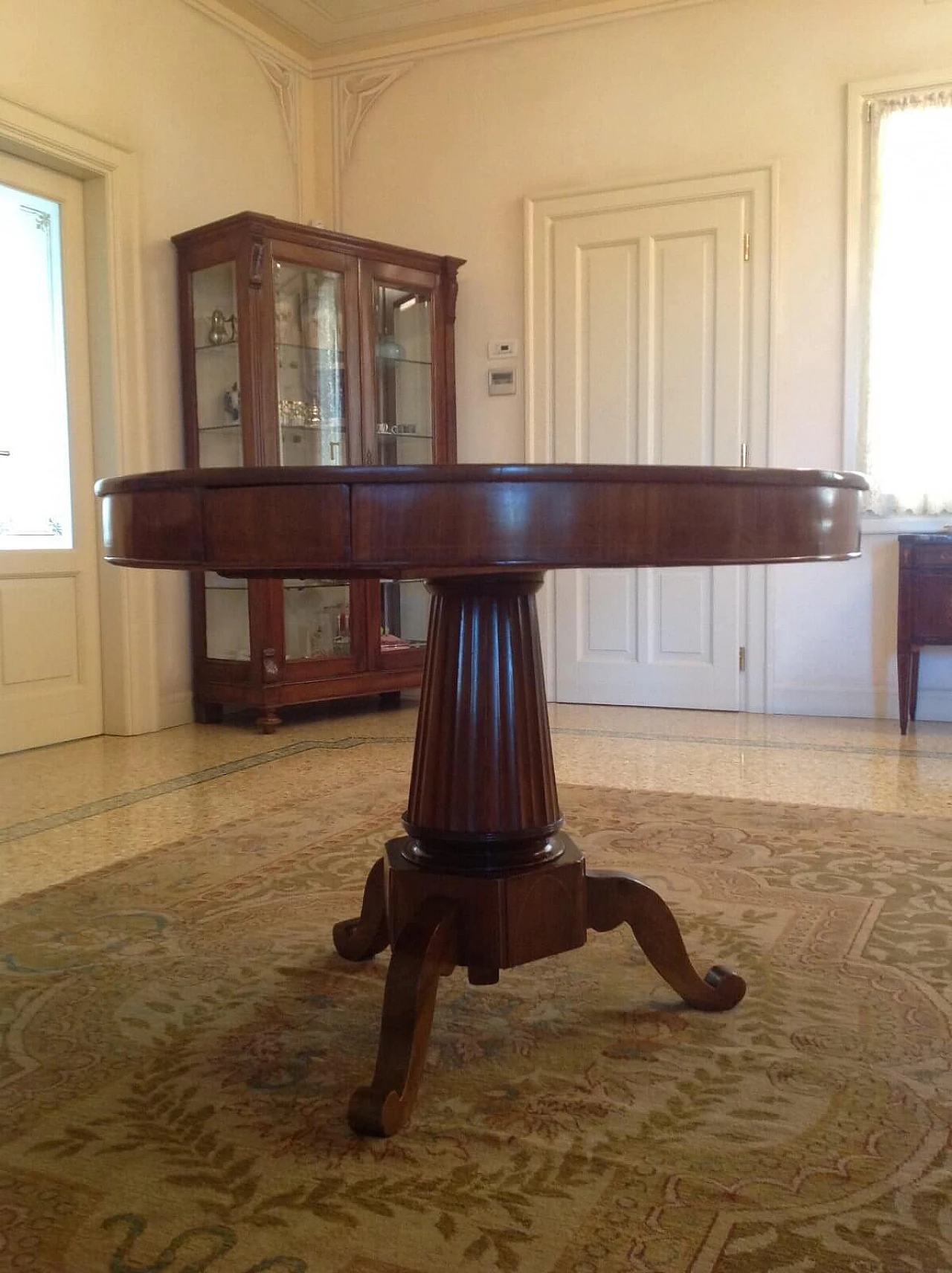 Empire style round table with central column, 19th century 2