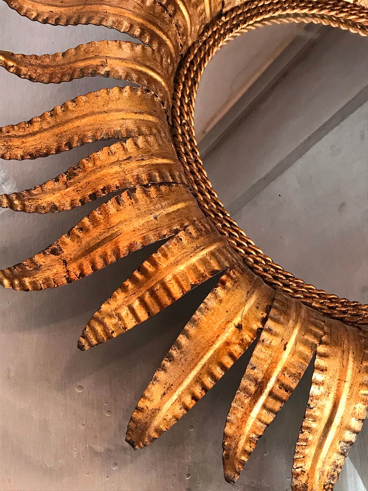 Mirror in a golden frame in the shape of a sun 3