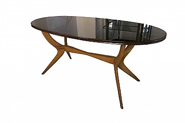 Tavolo ovale in vetro nero e legno, anni '50