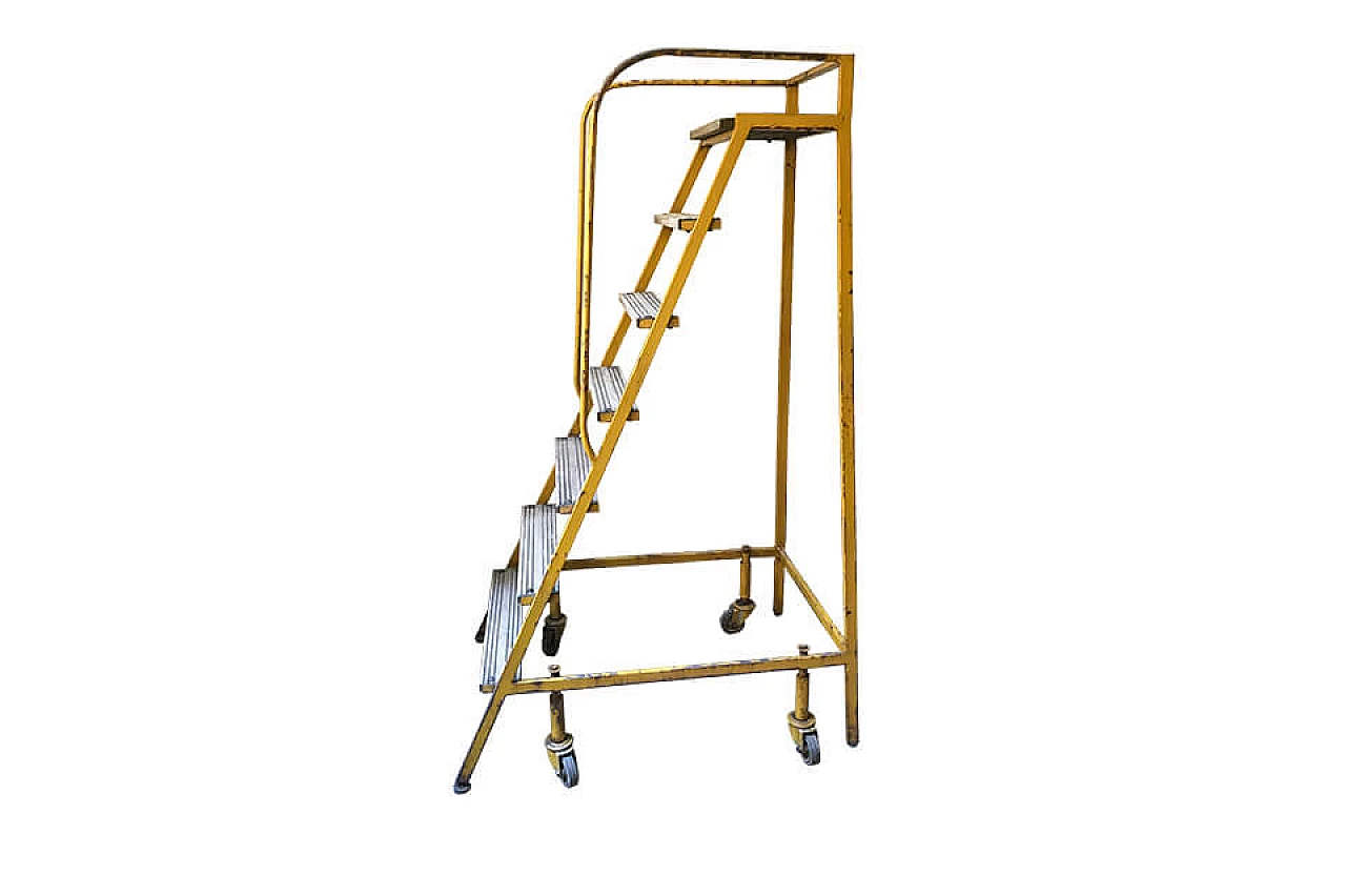 Yellow ladder with metal wheels 1