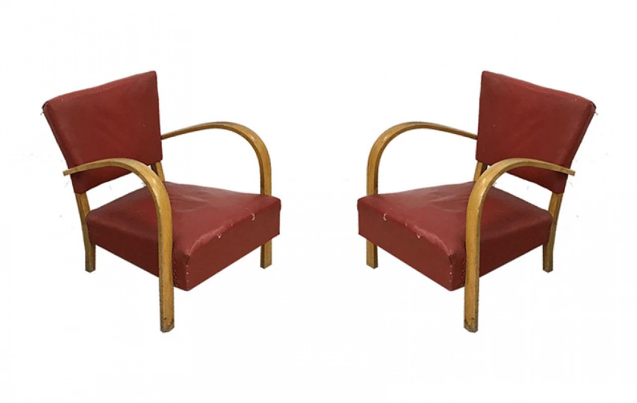 Pair of wooden and skai armchairs, 50's 1