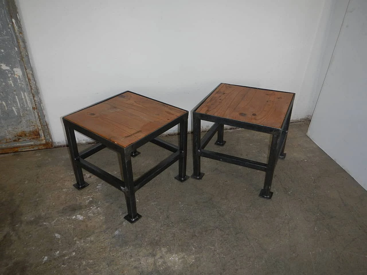 Pair of black metal and wood stools, 70s 1149280