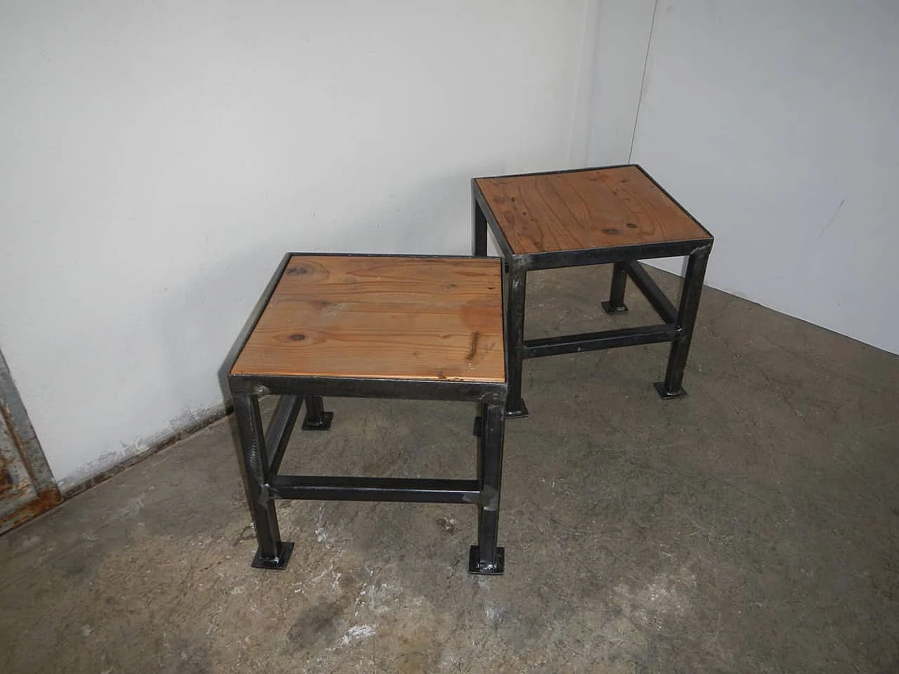 Pair of black metal and wood stools, 70s 1149281