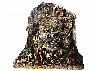 Nativity scene of Neapolitan origin in papier-mâché and figurines, 1960s