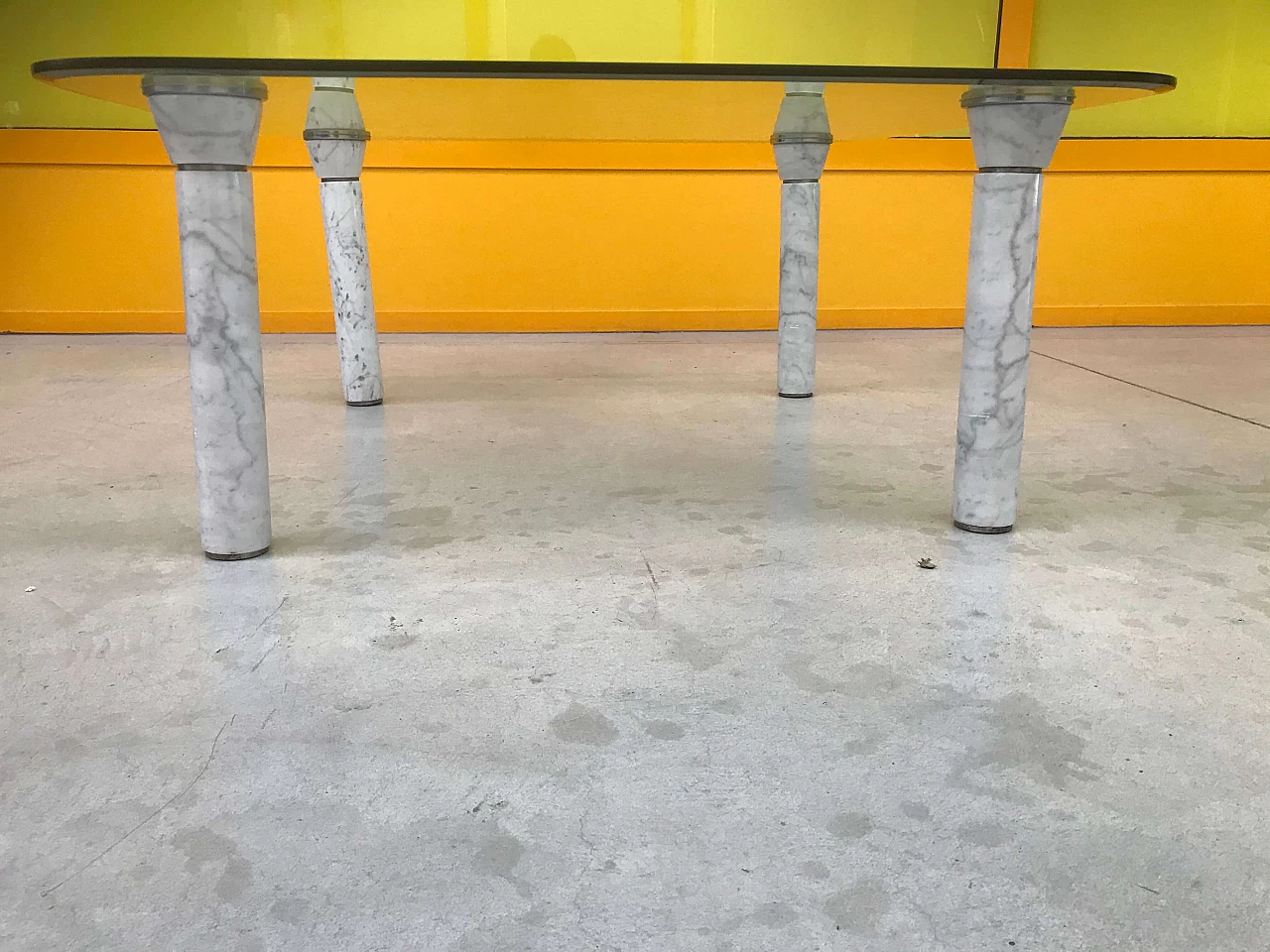 Glass top coffee table with marble legs, 60s 1166108