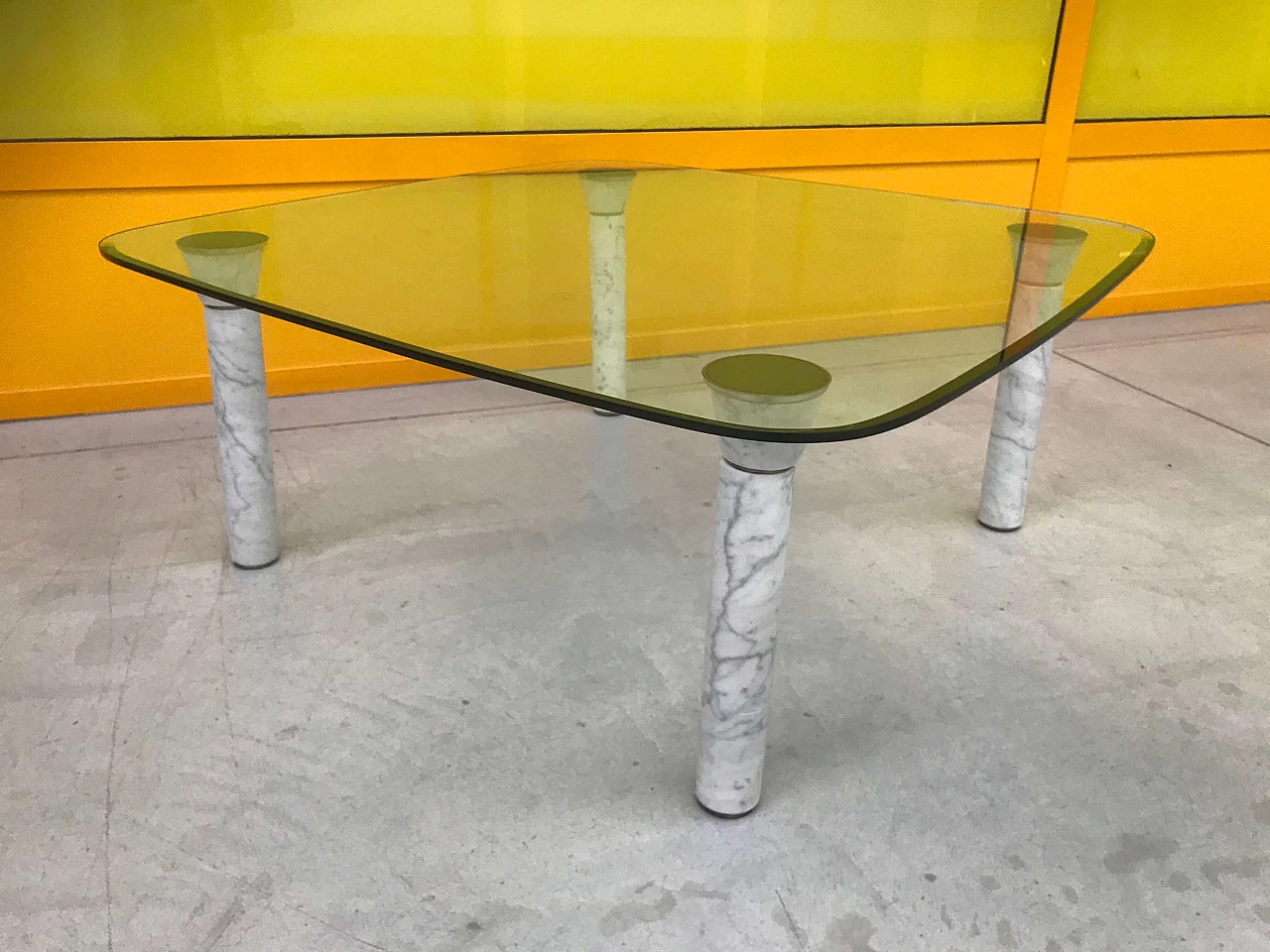 Glass top coffee table with marble legs, 60s 1166110