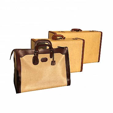 Set of leather and parchment suitcases