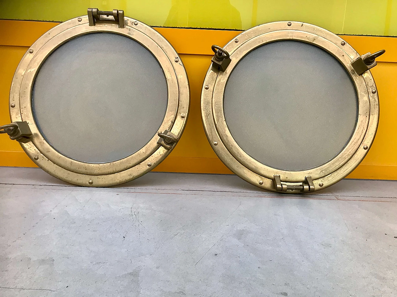 Pair of nautical ship portholes in gilded brass, 60s 1169532