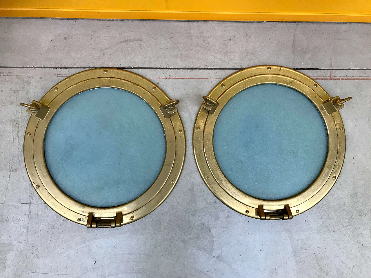 Pair of nautical ship portholes in gilded brass, 60s 1169536
