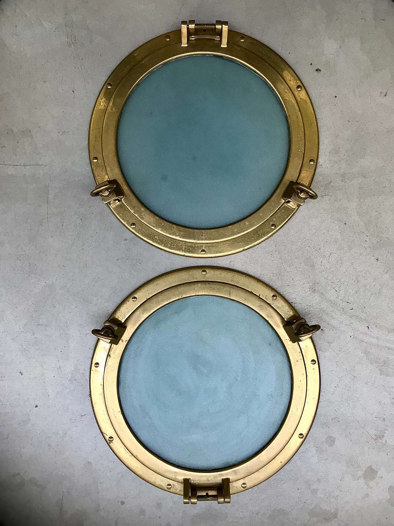 Pair of nautical ship portholes in gilded brass, 60s 1169537