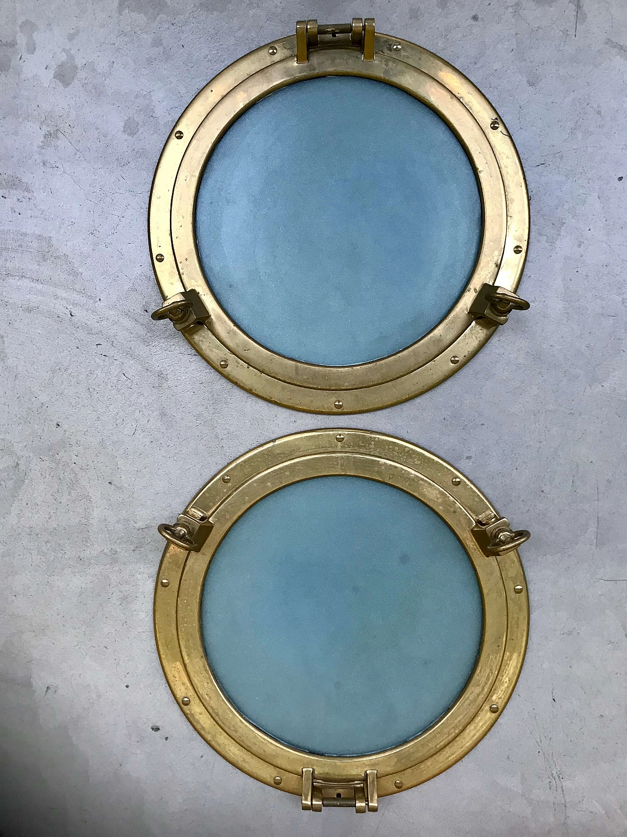 Pair of nautical ship portholes in gilded brass, 60s 1169538