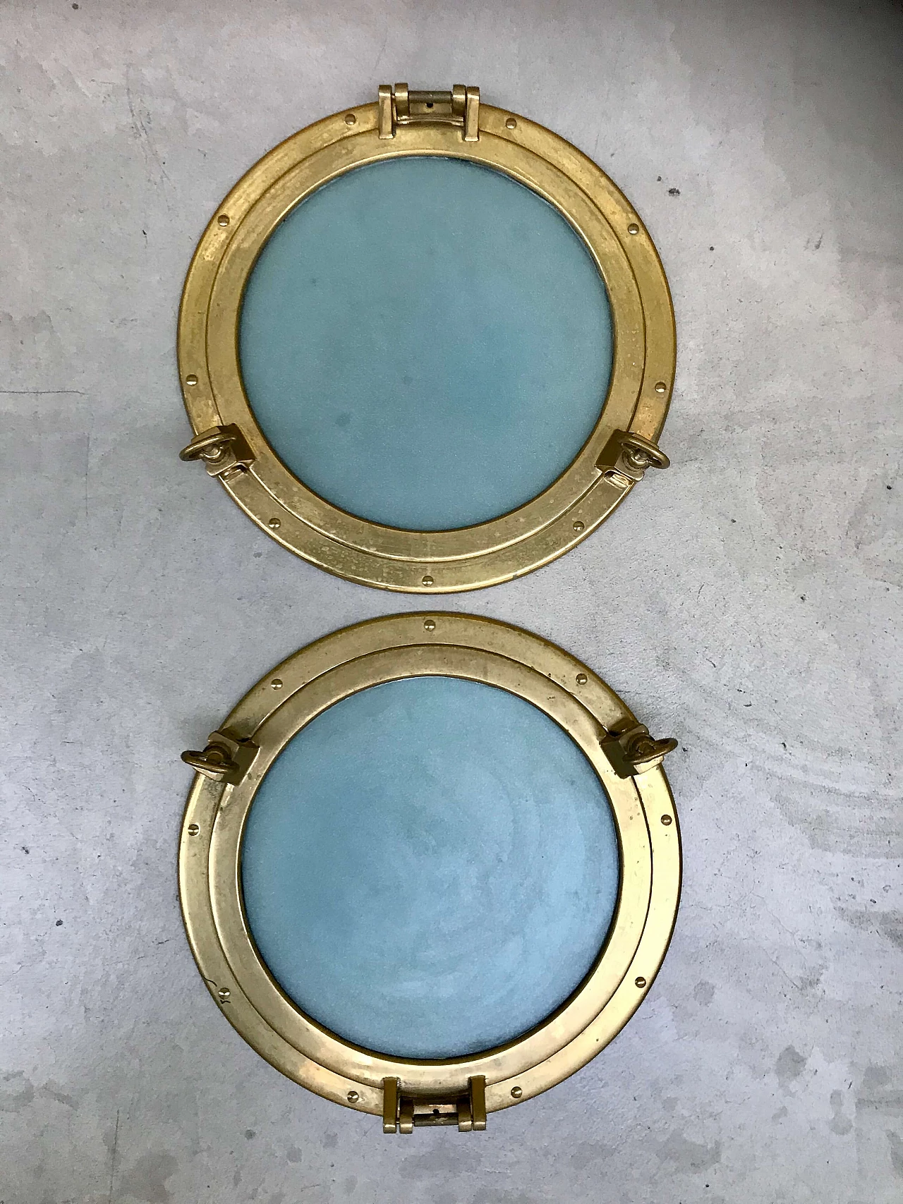 Pair of nautical ship portholes in gilded brass, 60s 1169539