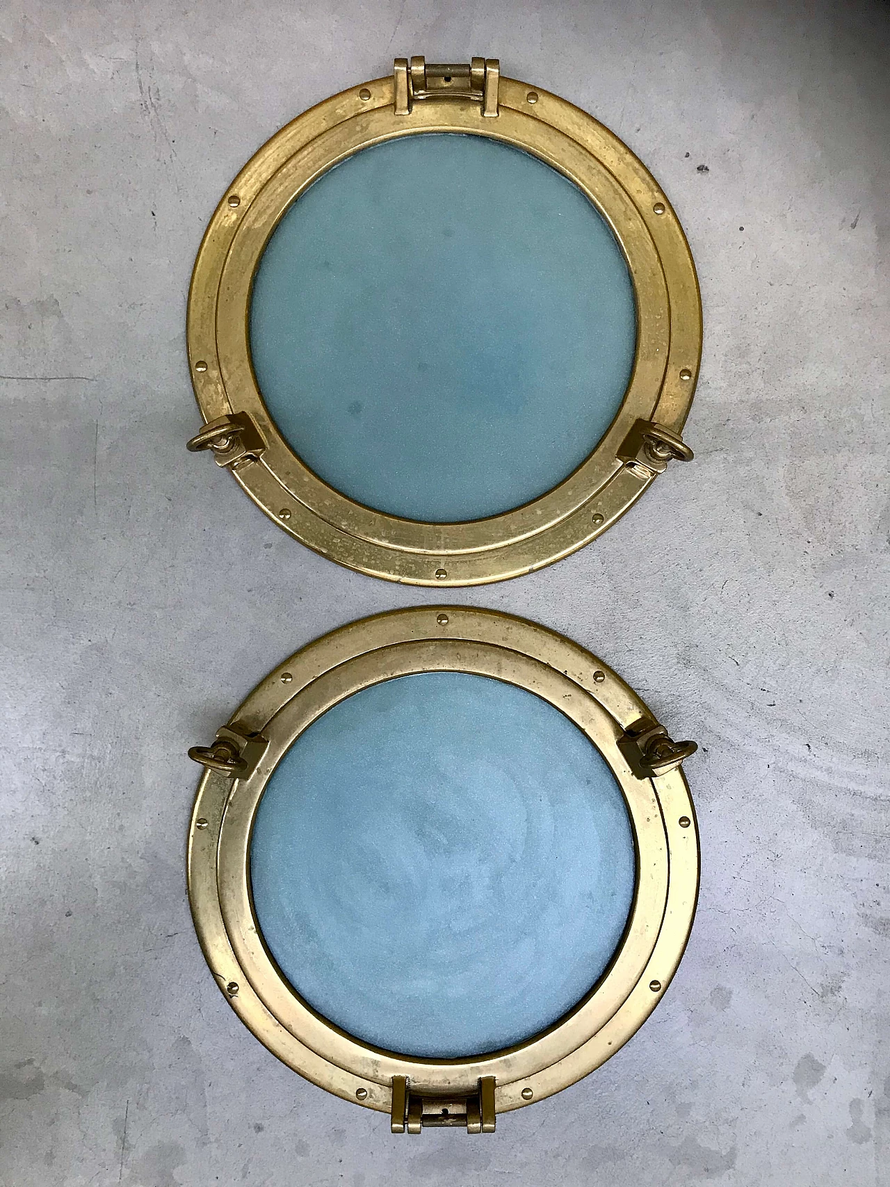 Pair of nautical ship portholes in gilded brass, 60s 1169540