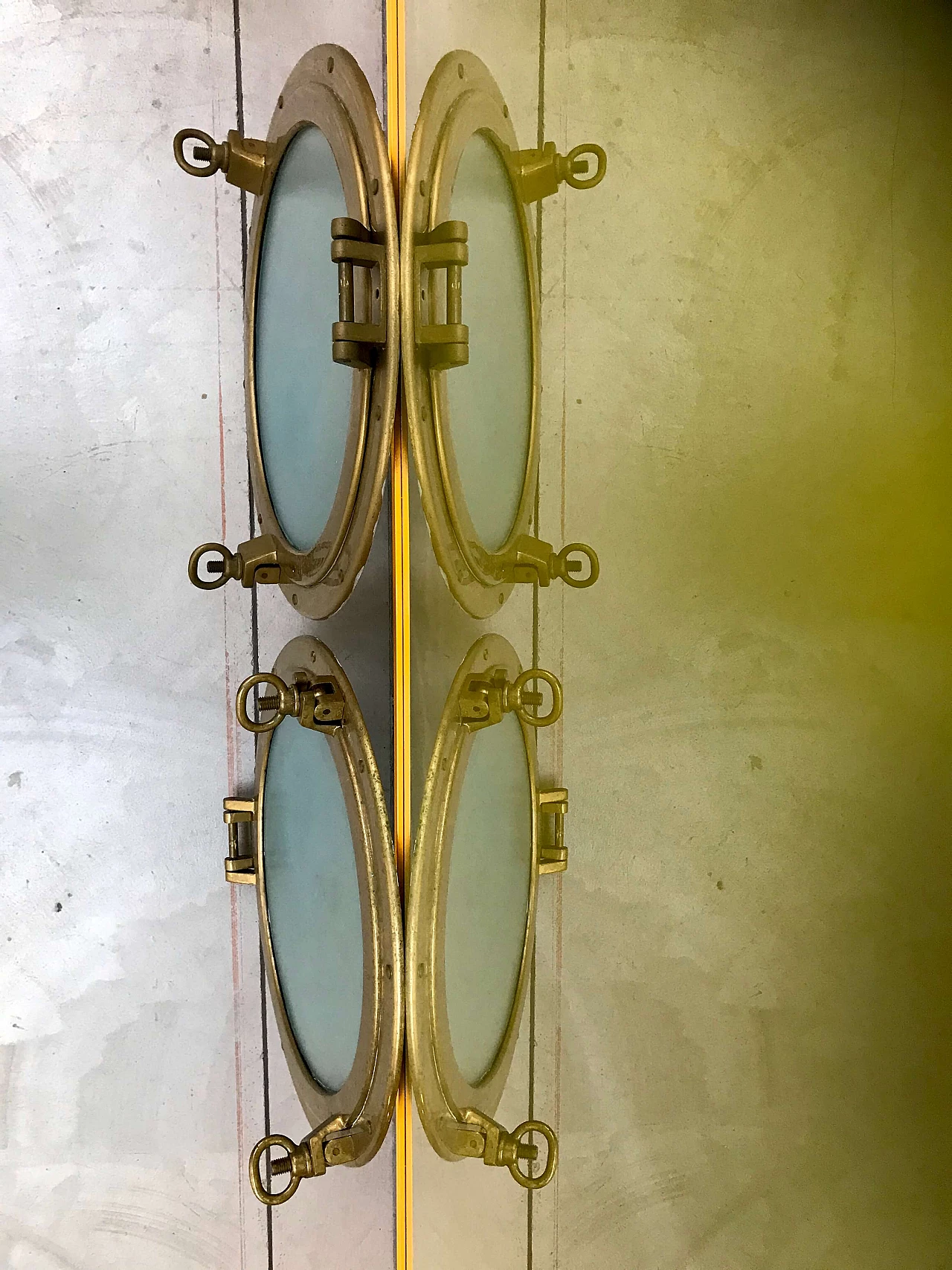 Pair of nautical ship portholes in gilded brass, 60s 1169542