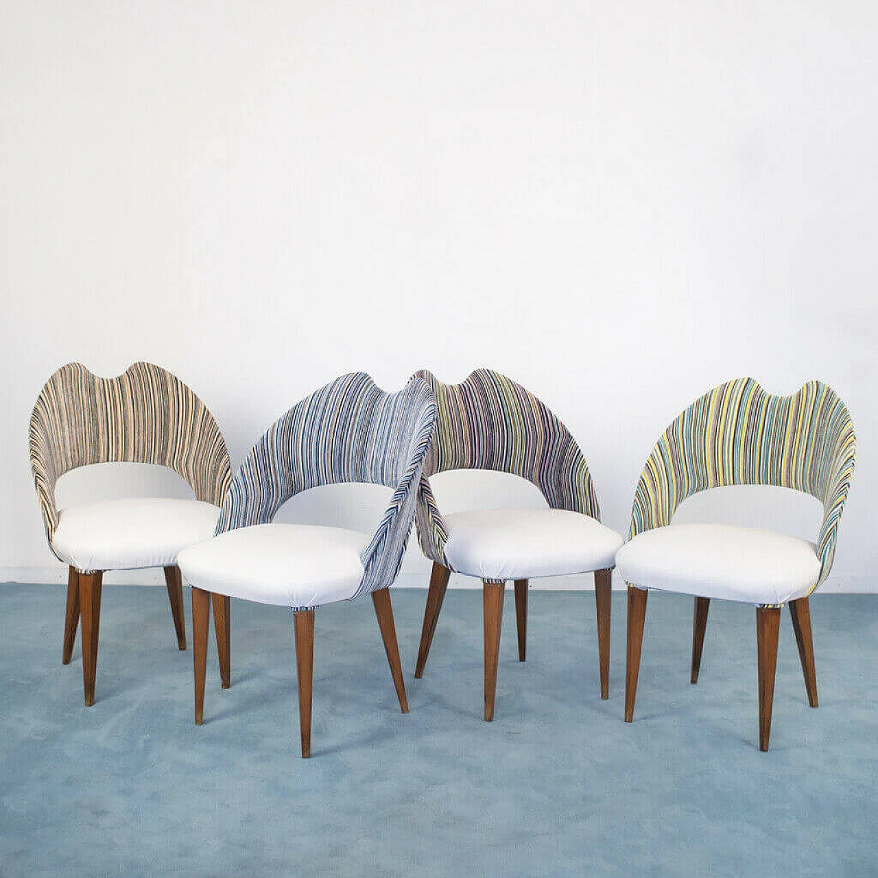 4 Chairs in wood and leatherette, 70s 1180203