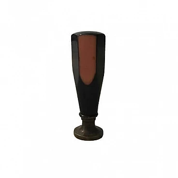 Bakelite seal, letters L M