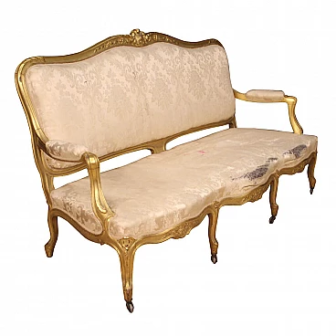 Golden French sofa in Louis XV style
