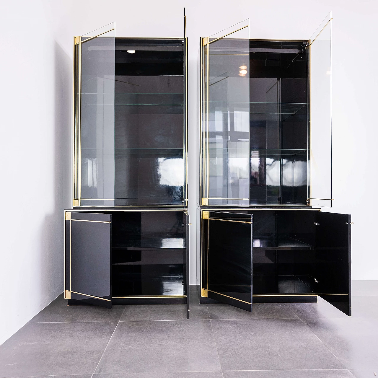 Pair of black showcase cabinets attributed to Pierre Cardin with brass details, 80s 1212265