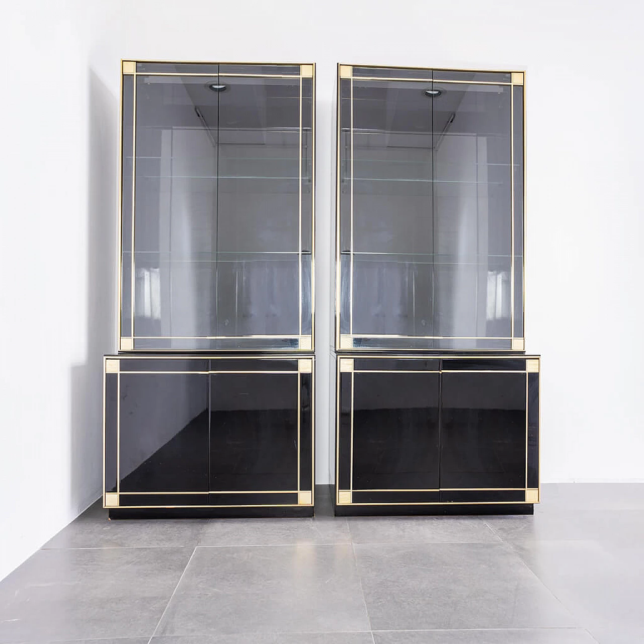 Pair of black showcase cabinets attributed to Pierre Cardin with brass details, 80s 1212267