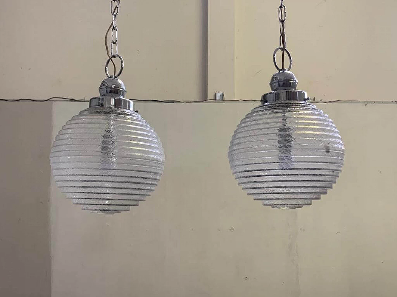 Pair of ball ceiling lamp with multi-strands engraving effect, 70s 1225874
