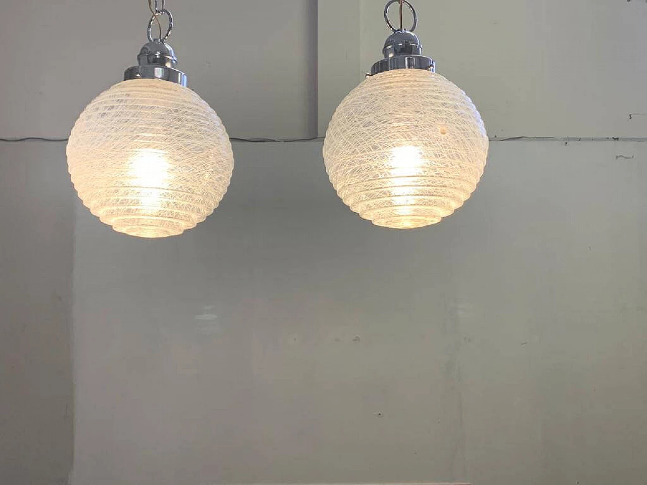 Pair of ball ceiling lamp with multi-strands engraving effect, 70s 1225876