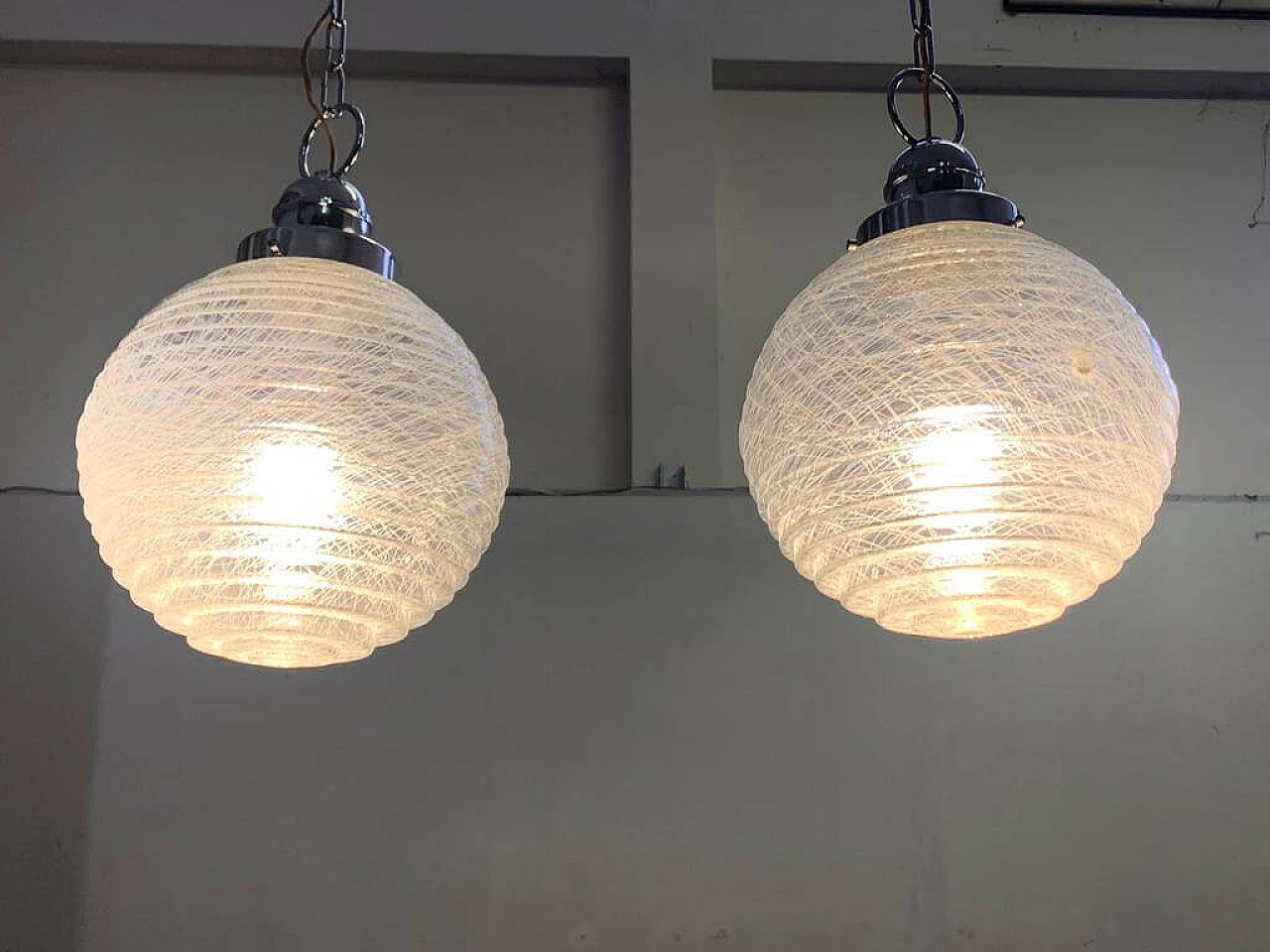 Pair of ball ceiling lamp with multi-strands engraving effect, 70s 1225877