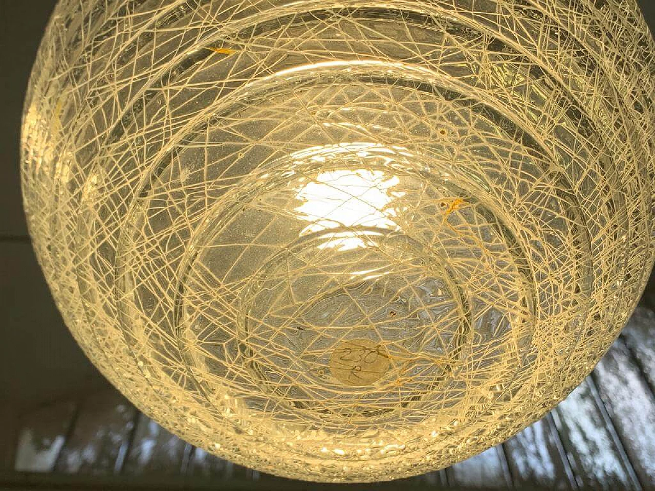 Pair of ball ceiling lamp with multi-strands engraving effect, 70s 1225878