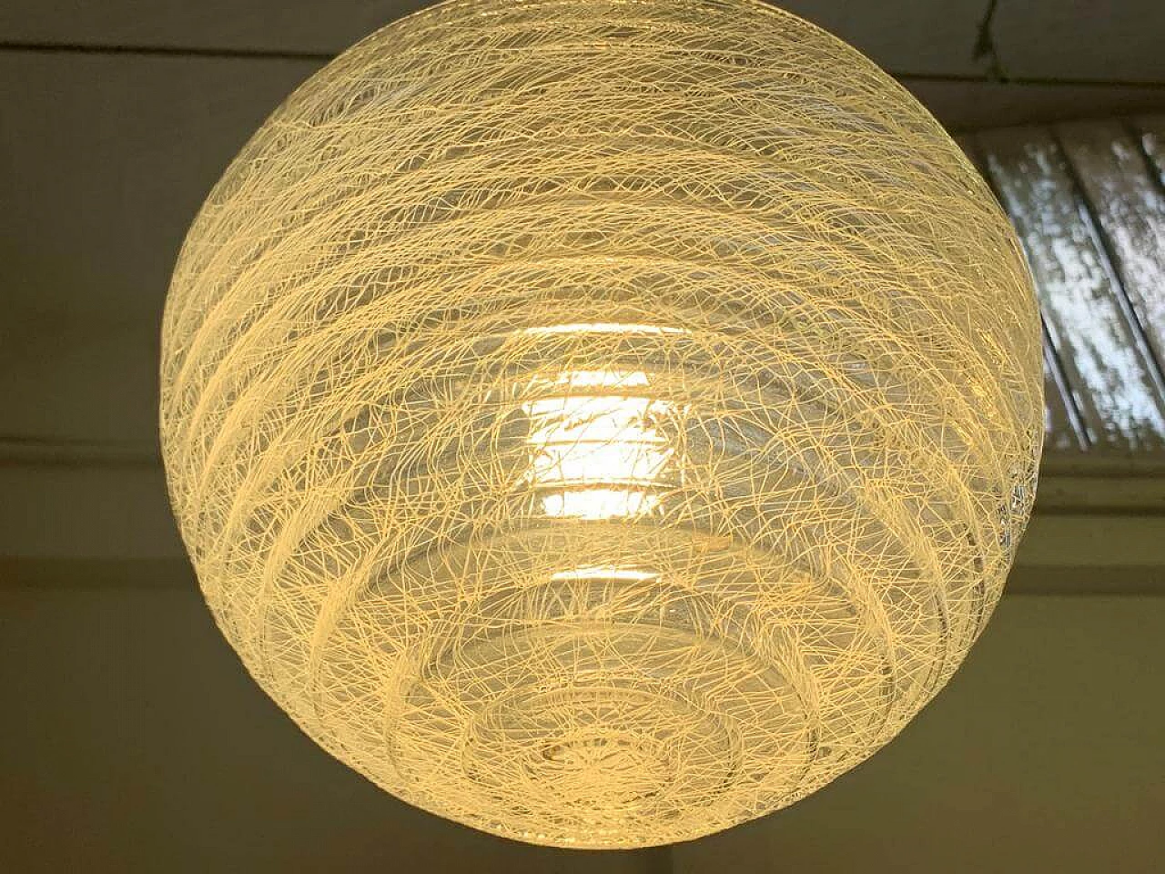 Pair of ball ceiling lamp with multi-strands engraving effect, 70s 1225880