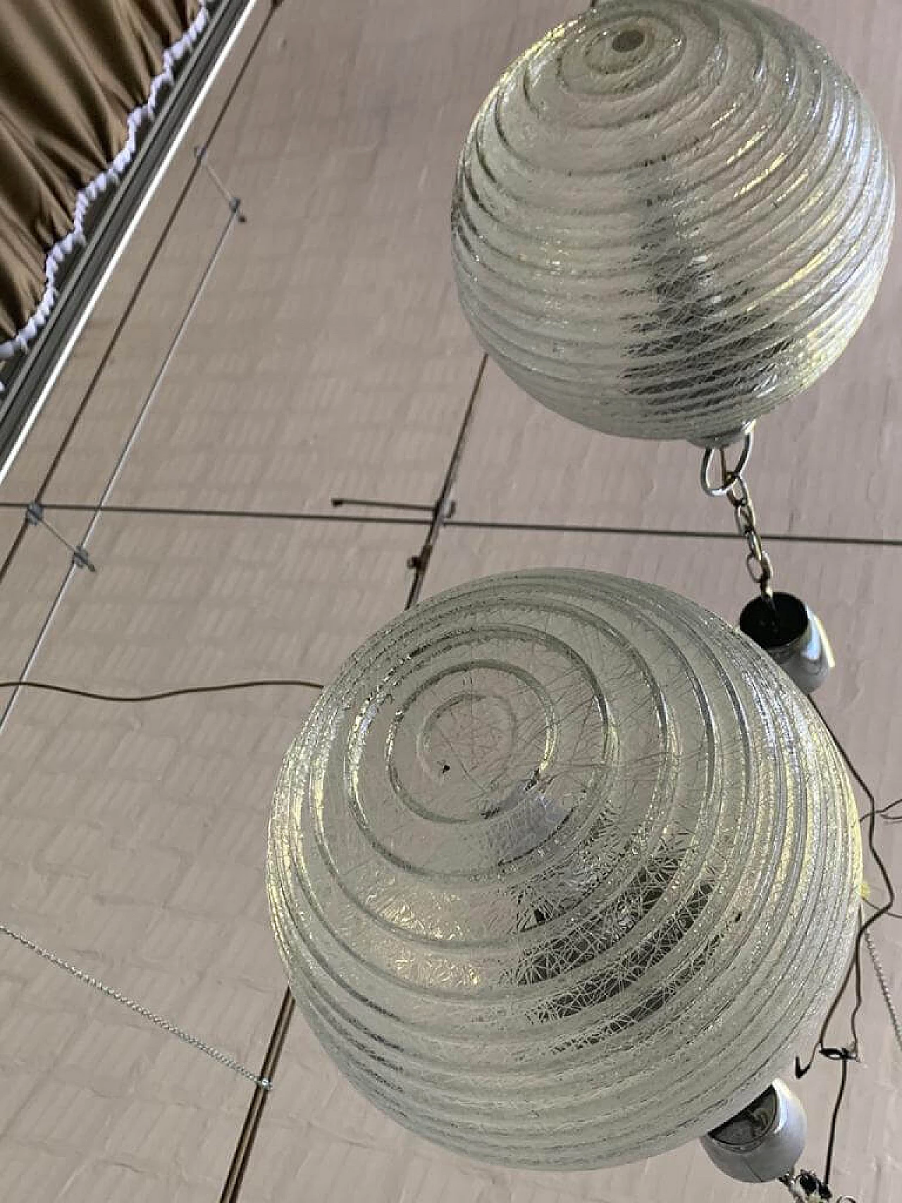 Pair of ball ceiling lamp with multi-strands engraving effect, 70s 1225886