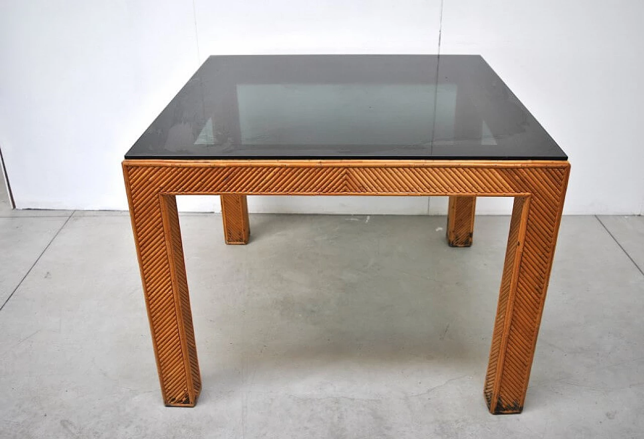 Table in wicker and smoked glass, 70s 1228449