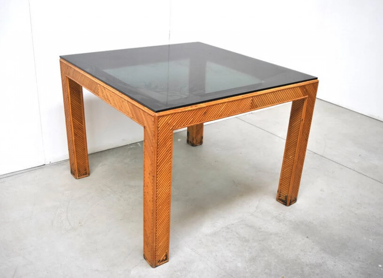 Table in wicker and smoked glass, 70s 1228450