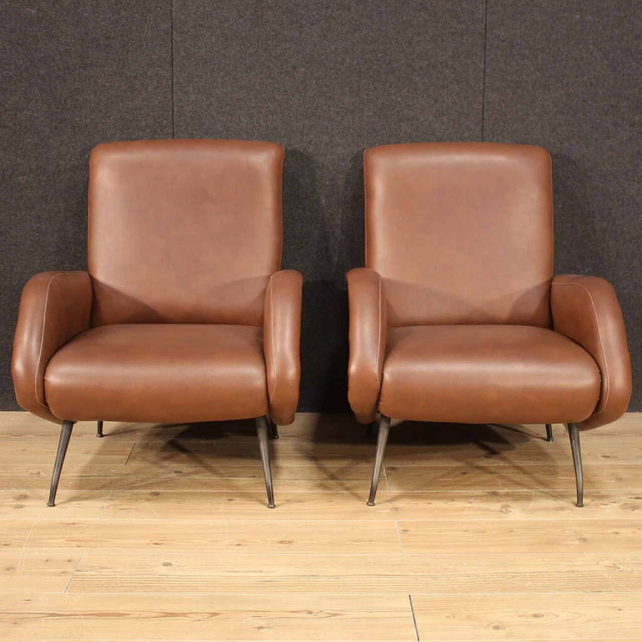 Pair of armchairs in skai with metal legs, 70s 1230597