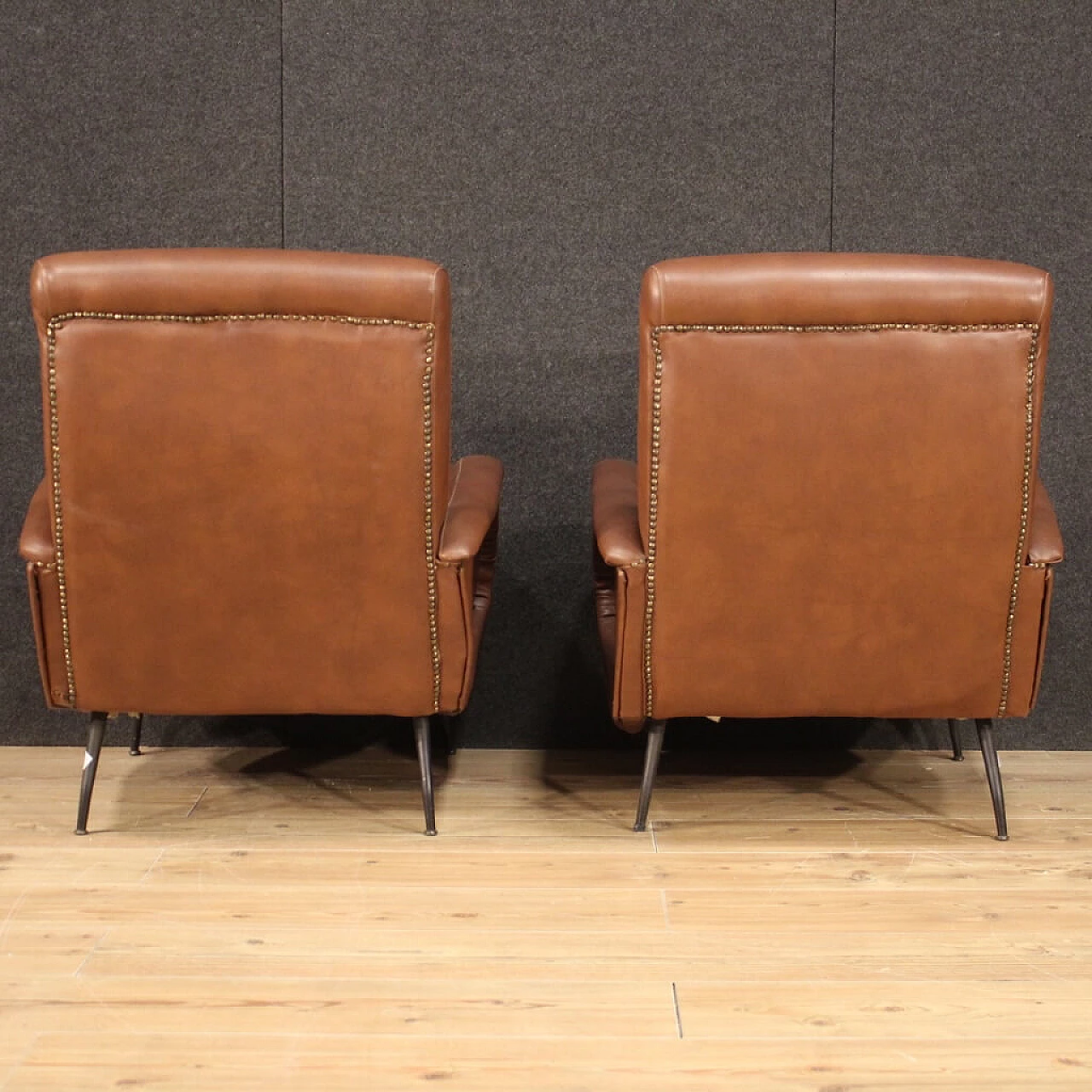 Pair of armchairs in skai with metal legs, 70s 1230599