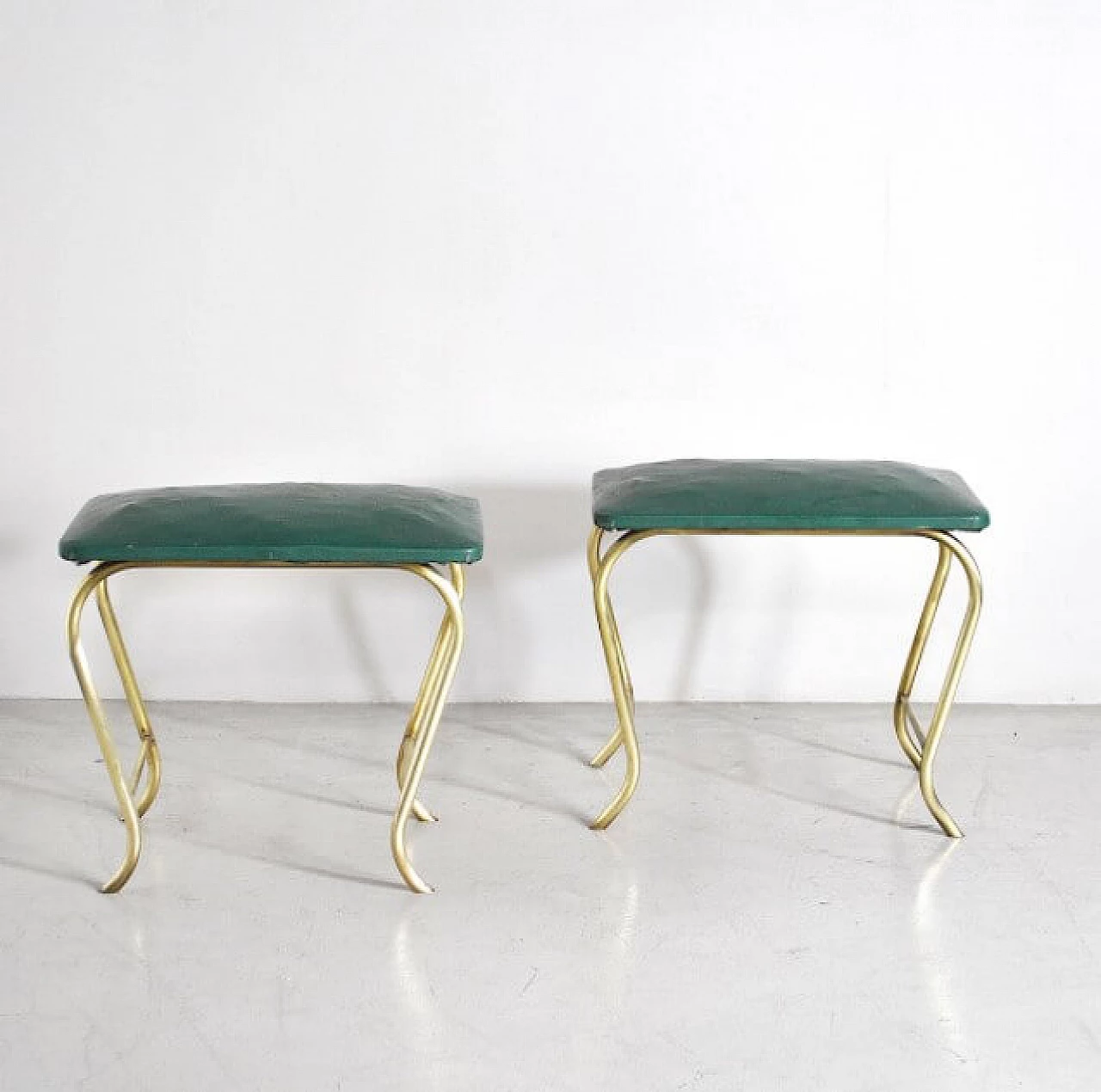 Pair of ottomans with tubular brass frame and green vinyl seats, 60s 1233914