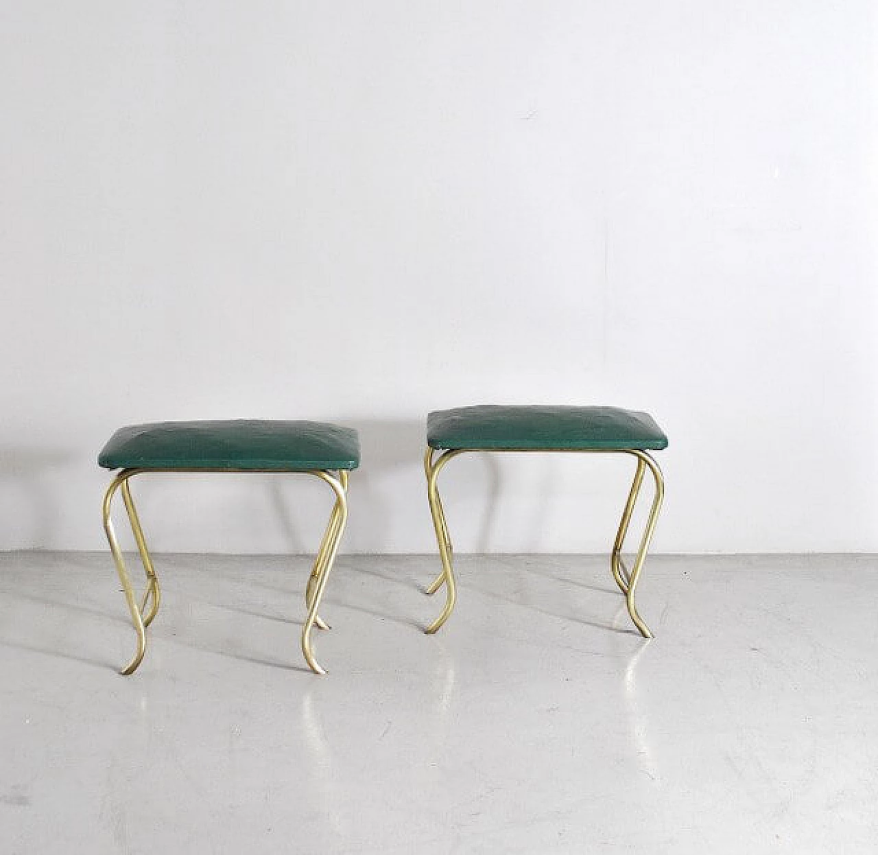 Pair of ottomans with tubular brass frame and green vinyl seats, 60s 1233917