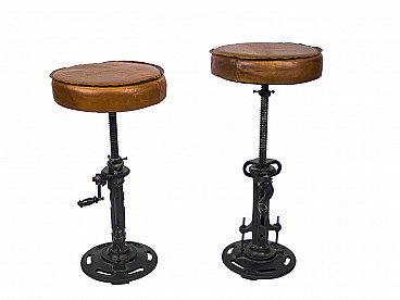 Pair of cast iron and leather bar stools, 80s
