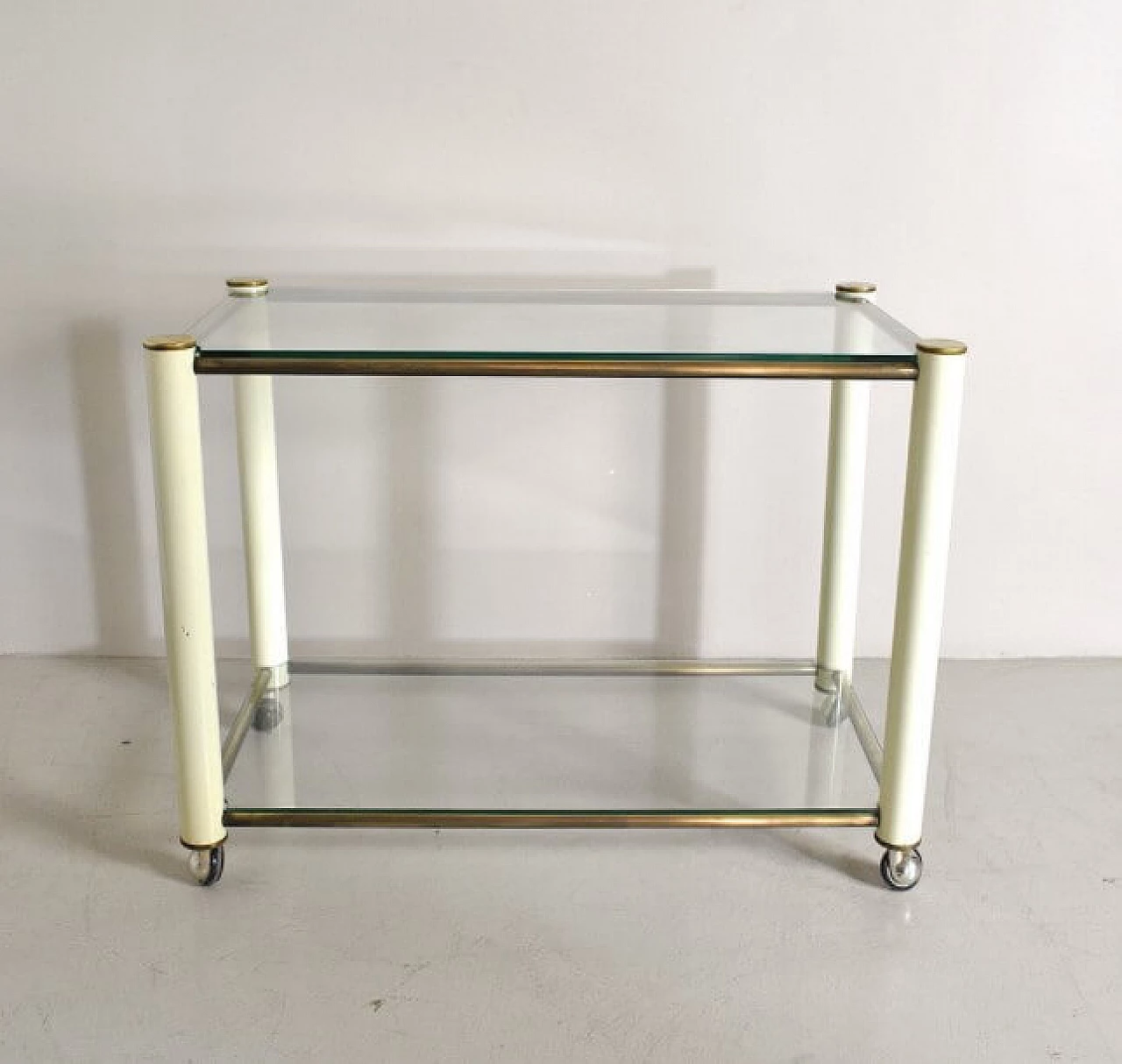 Trolley in brass and lacquered metal with 2 glass shelves in the style of Tommaso Barbi, 70s 1252514