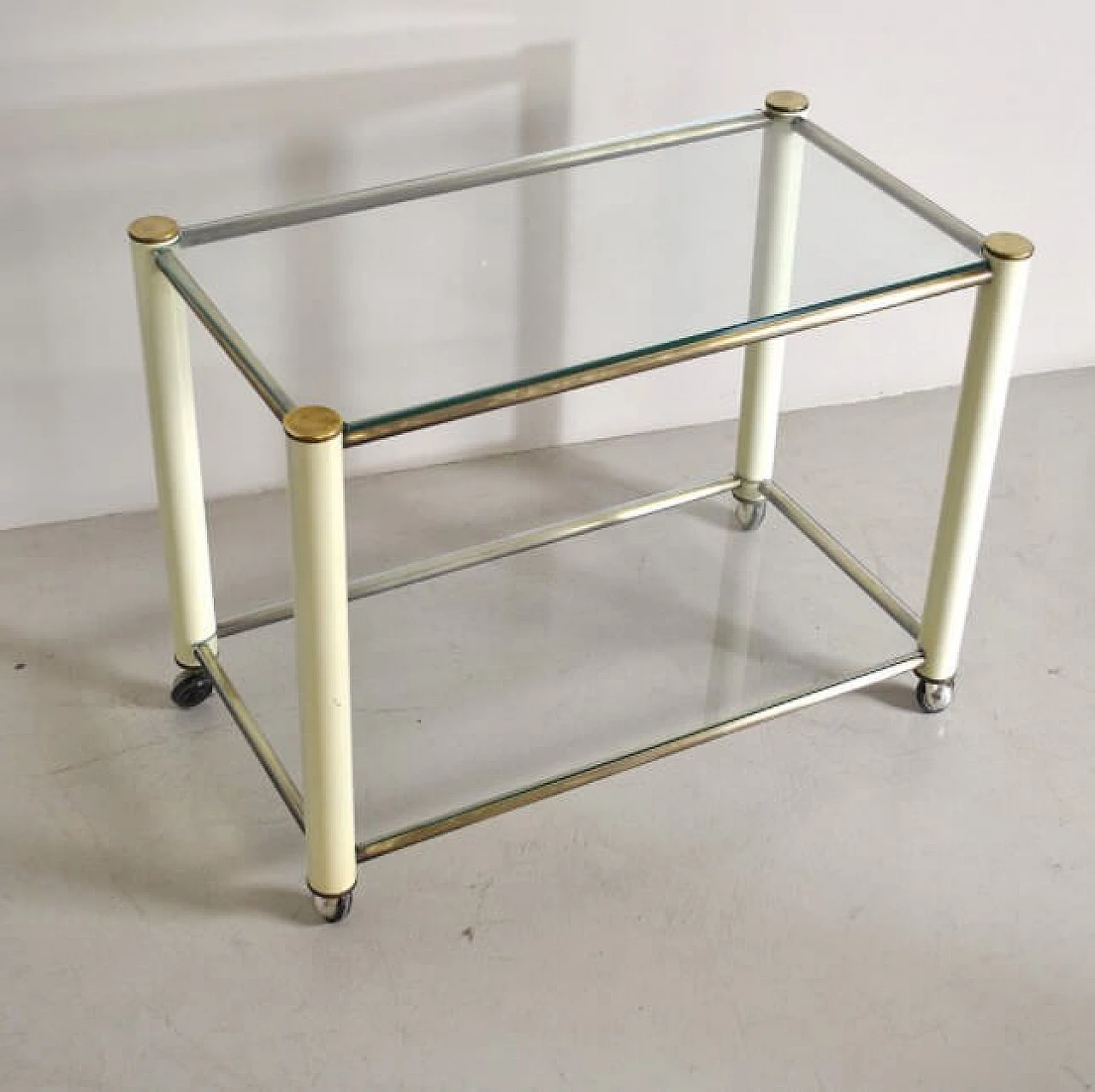 Trolley in brass and lacquered metal with 2 glass shelves in the style of Tommaso Barbi, 70s 1252516