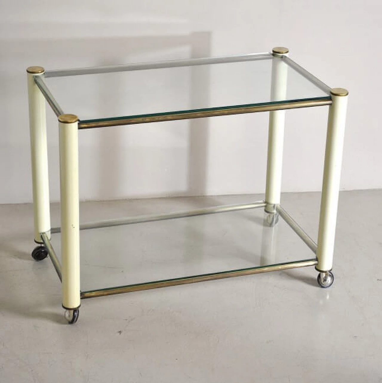 Trolley in brass and lacquered metal with 2 glass shelves in the style of Tommaso Barbi, 70s 1252517