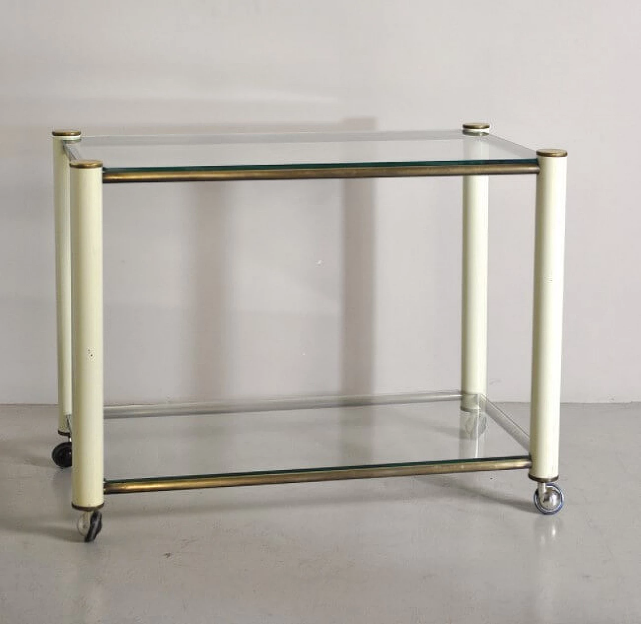 Trolley in brass and lacquered metal with 2 glass shelves in the style of Tommaso Barbi, 70s 1252518