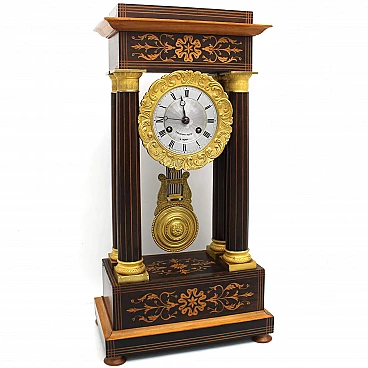 Charles X pendulum clock in inlaid rosewood and bronze, 19th century