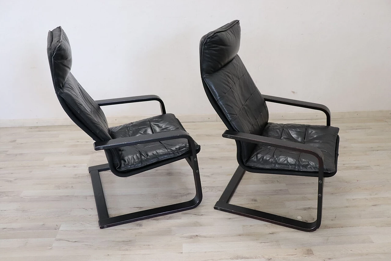 Pair of armchairs in black leather, 70s 1280652