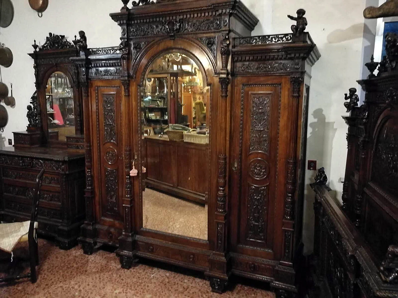 Closet in carved and sculpted walnut with mirror by Sellerio Giuseppe, 19th century 1361389