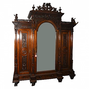 Closet in carved and sculpted walnut with mirror by Sellerio Giuseppe, 19th century