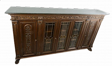 Carved showcase bookcase with lion's paw feet and leatherette top