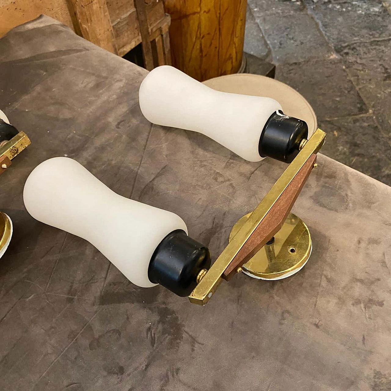 A pair of brass, teak and glass wall lamps in the Stilnovo style, 1950s 1377575