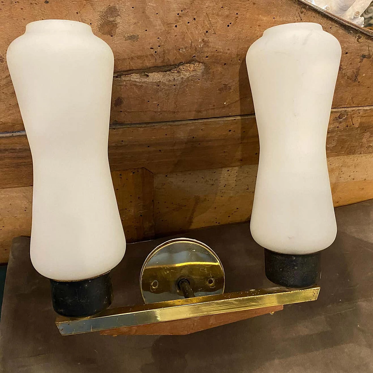 A pair of brass, teak and glass wall lamps in the Stilnovo style, 1950s 1377576