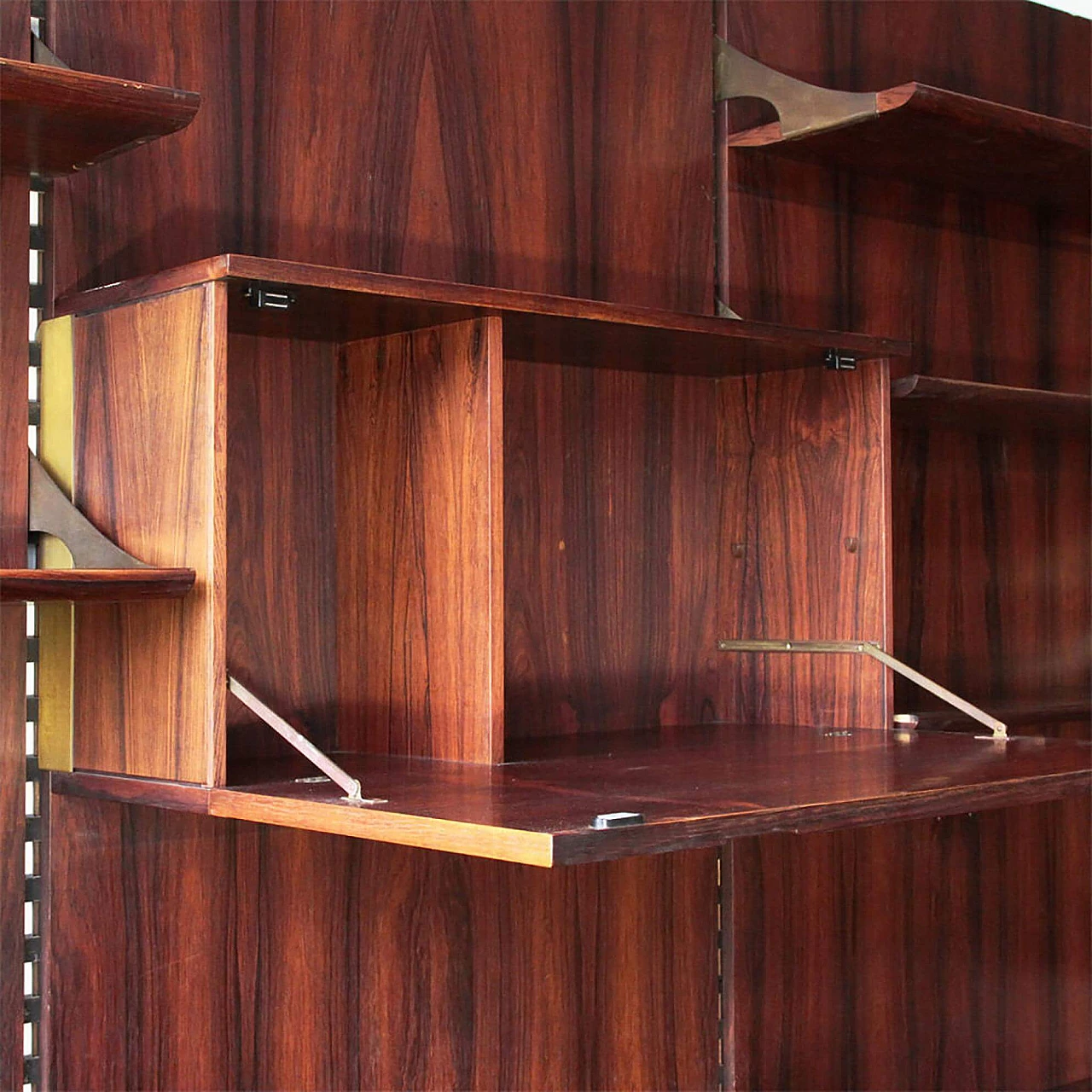 Wall-mounted wooden and brass bookcase by Raffaella Crespi for Mobilia, 1960s 1386551